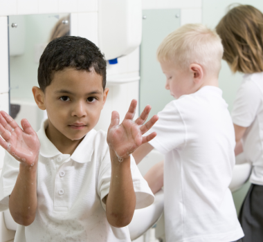 kids washing hands in restroom